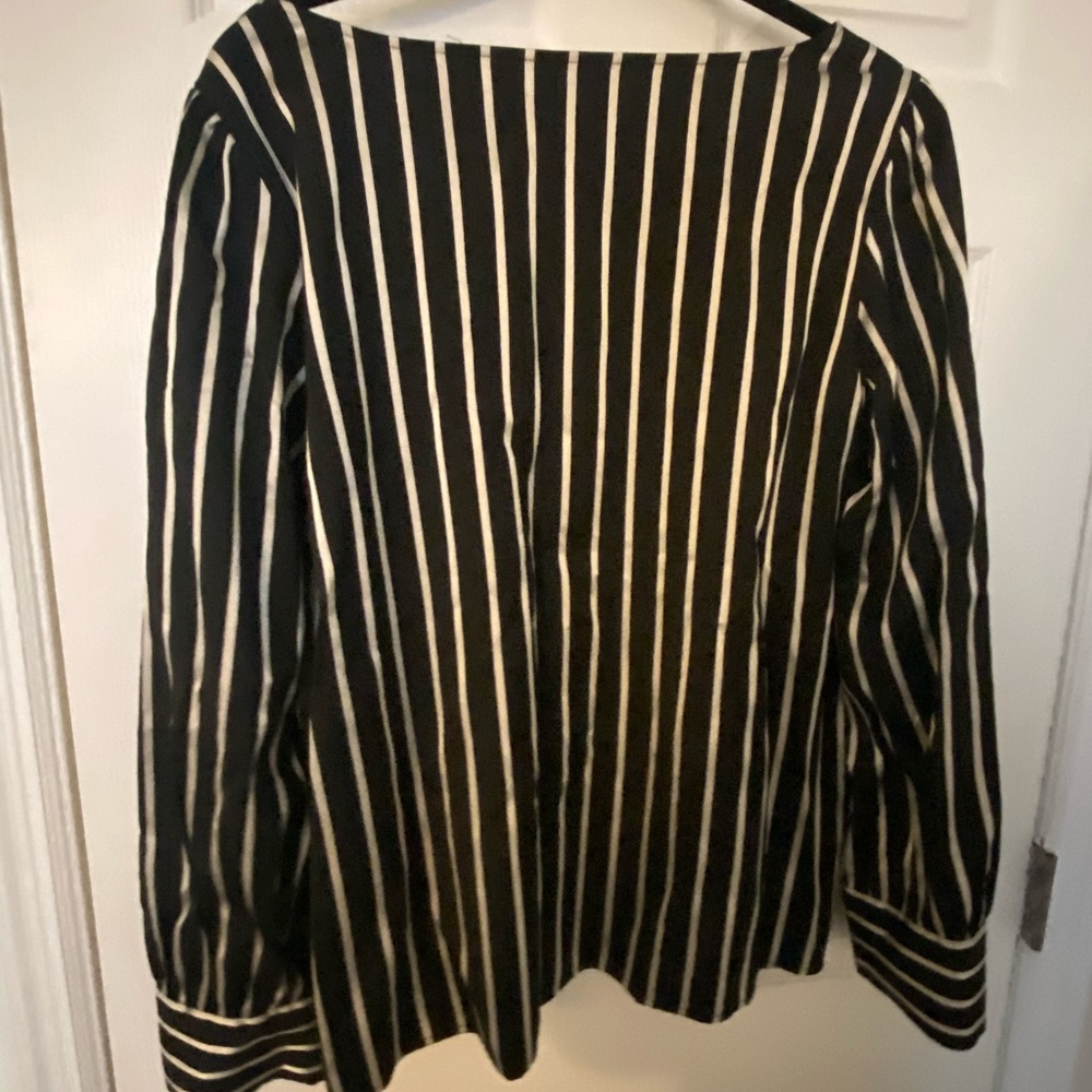 Long sleeved black& silver striped shirt.
